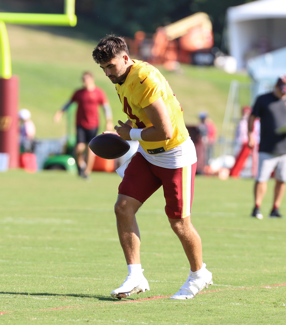 Washington Commanders Quarterback Sam Howell (14) throwing some