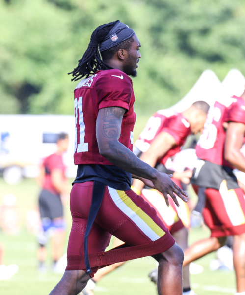 Washington Commanders Safety Kamren Curl doing morning stretches