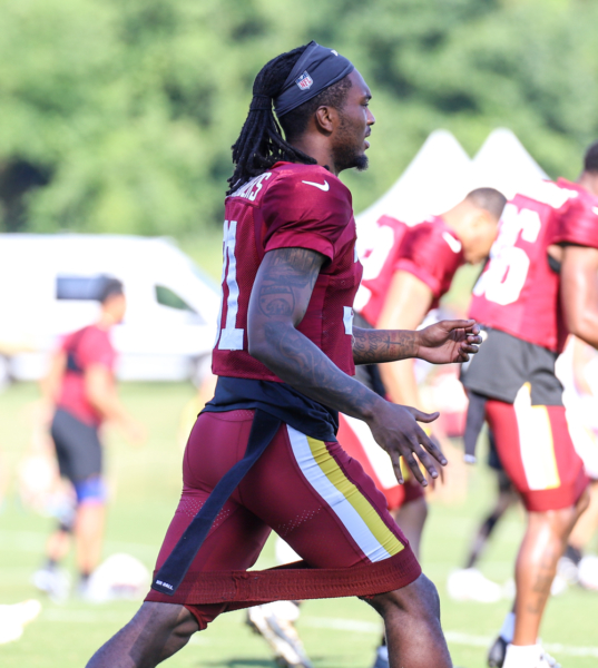 Washington Commanders Safety Kamren Curl doing morning stretches