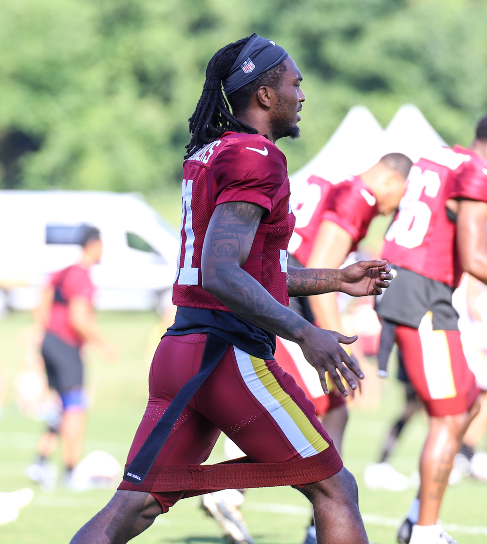 Washington Commanders Safety Kamren Curl doing morning stretches