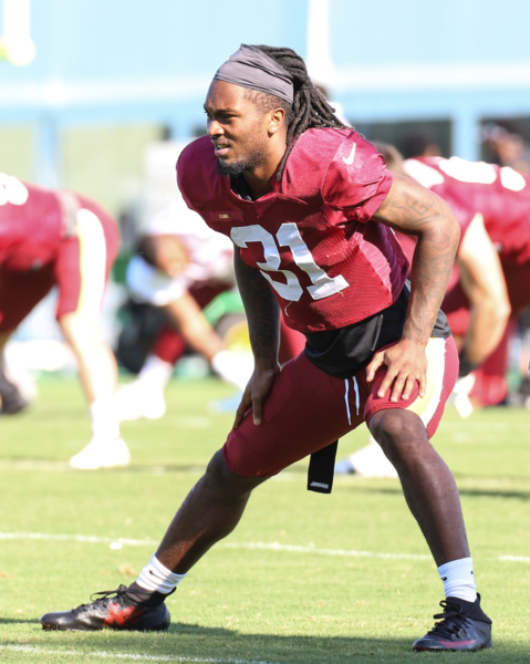 Washington Commanders Safety Kamren Curl (32) doing morning stre