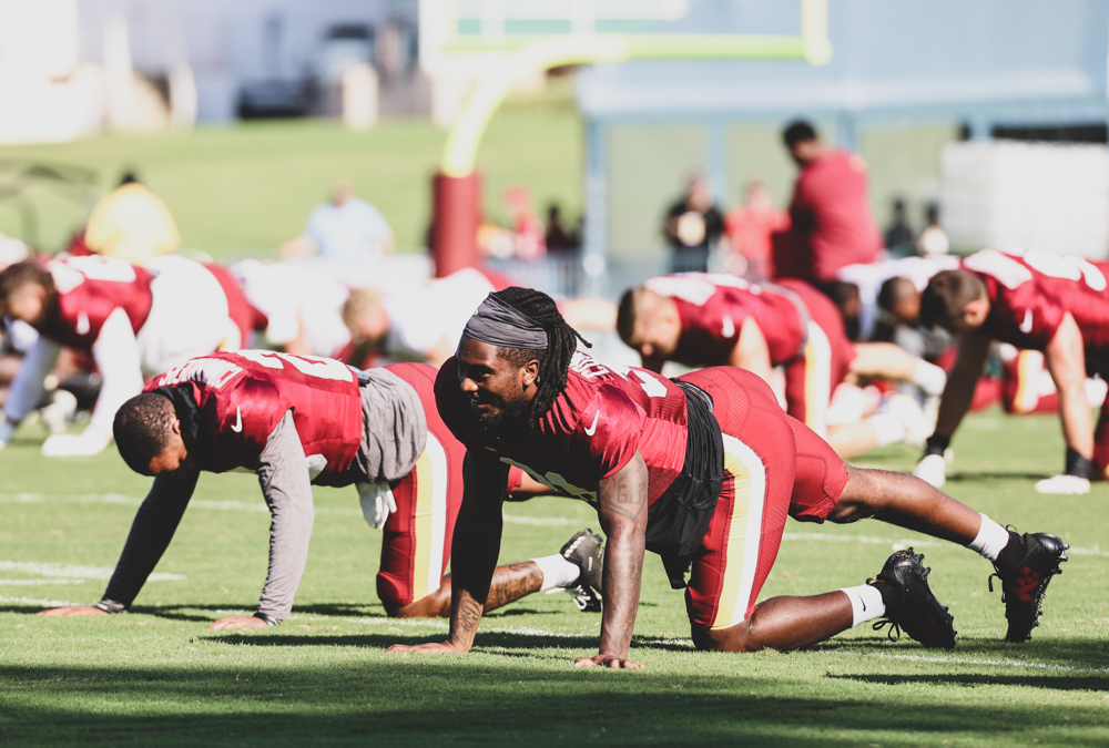 Washington Commanders Safety Kamren Curl (32) doing morning stre