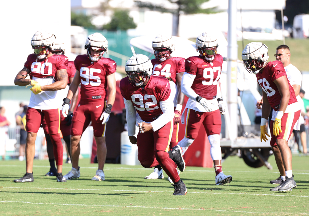 Washington Commanders Defensive End Daniel Wise (92) doing runni