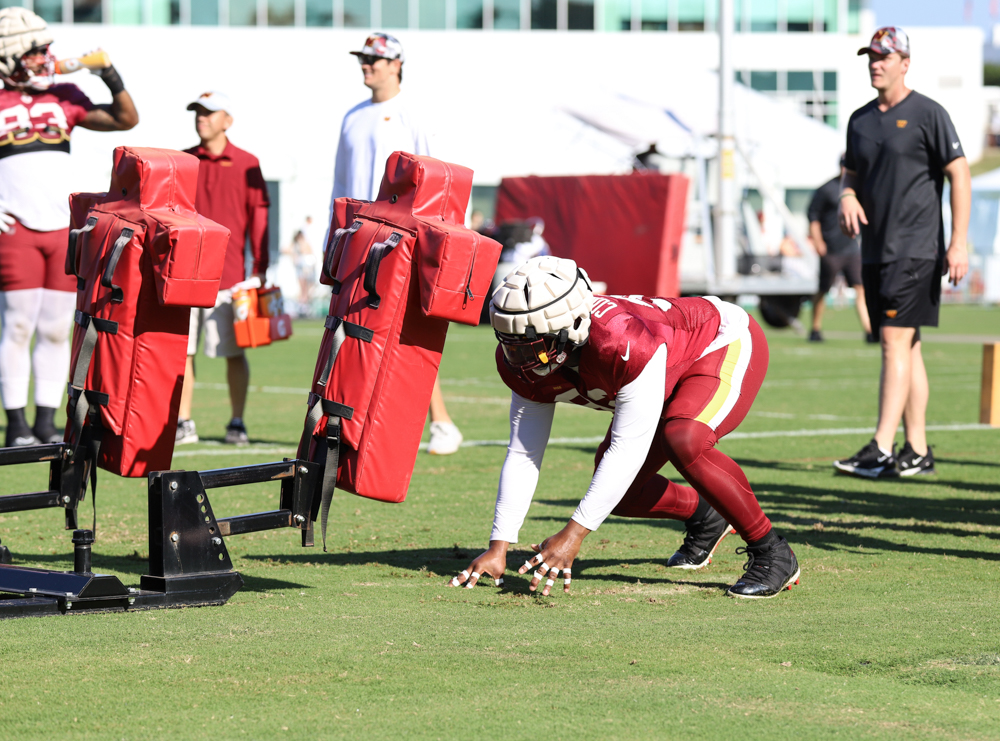 Washington Commanders Defensive End Daniel Wise (92) hitting the