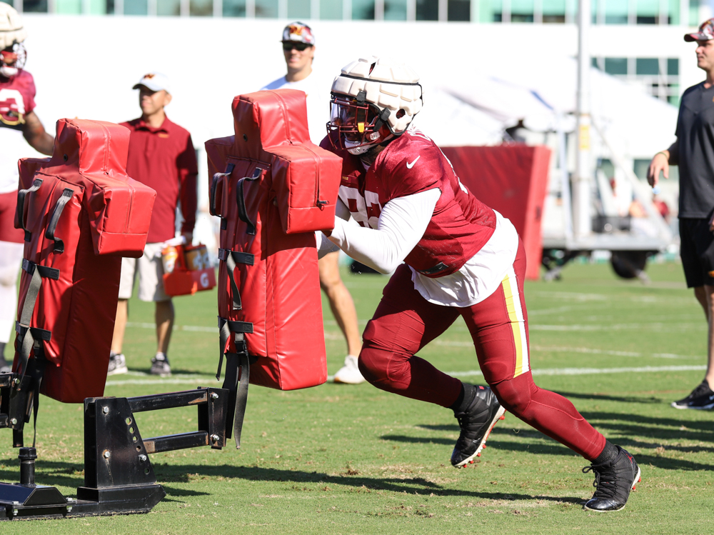 Washington Commanders Defensive End Daniel Wise (92) hitting the