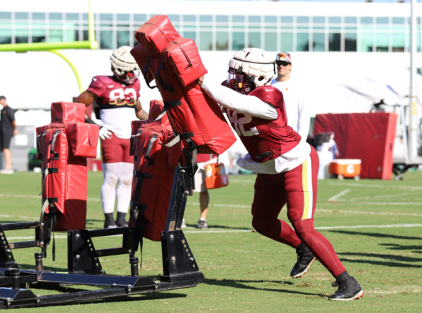Washington Commanders Defensive End Daniel Wise (92) hitting the