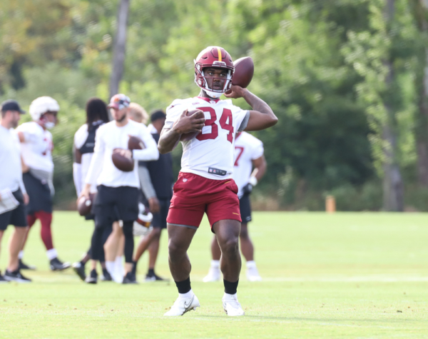 WR Jequez Ezzard (84) tosses the ball back to the coach at the C