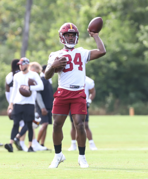 WR Jequez Ezzard (84) tosses the ball back to the coach at the C