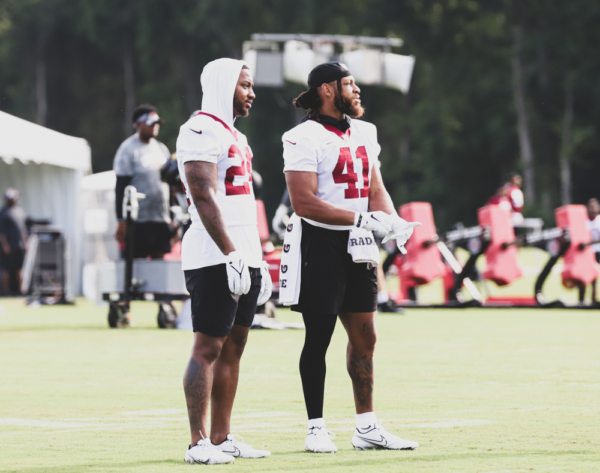 RB Antonio Gibson (24) and RB Jonathan Williams (41) catching up