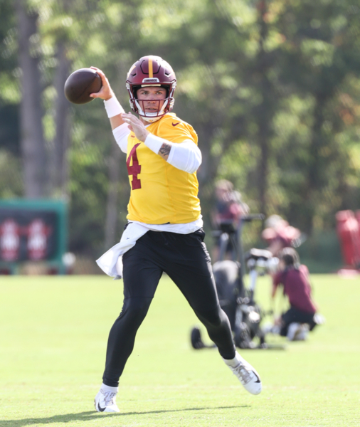 Quarterback Taylor Heinicke (4) about to make throw at the Comma