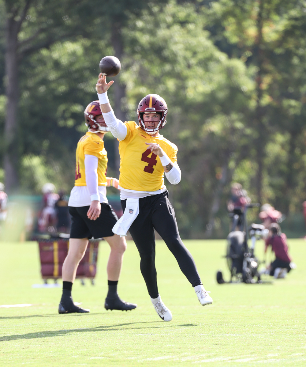 Quarterback Taylor Heinicke (4) makes a throw at the Commanders