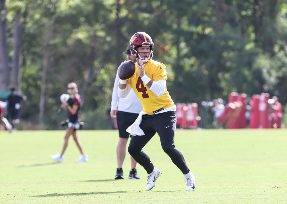 Quarterback Taylor Heinicke (4) prepares to make a throw at the