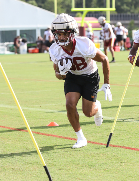 RB Reggie Bonofon (38) running the ball at the Commanders traini