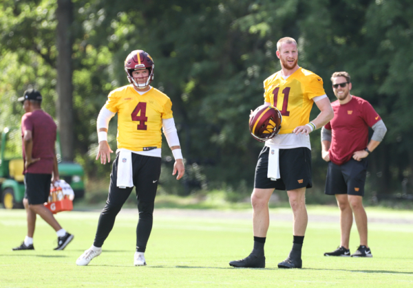 Quarterbacks Carson Wentz (11) and Taylor Heinicke (4) waiting f