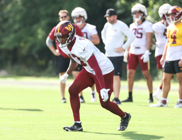 WR Terry McLaurin (17) set to making a running play on the field