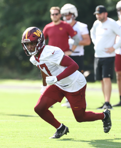 WR Terry McLaurin (17) set to making a running play on the field