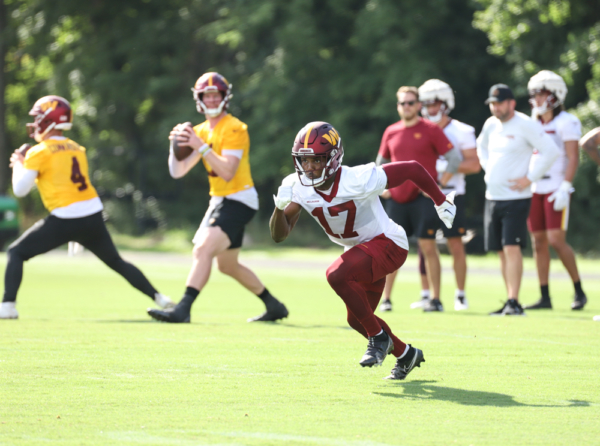 WR Terry McLaurin (17) set to making a running play on the field