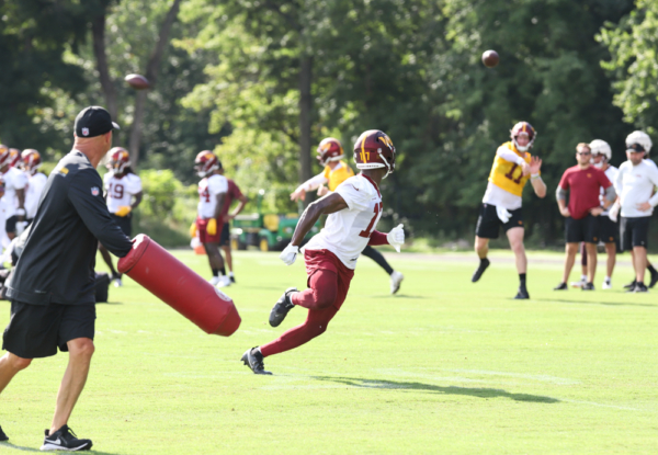 WR Terry McLaurin (17) about to make a catch from Wentz (4) at t