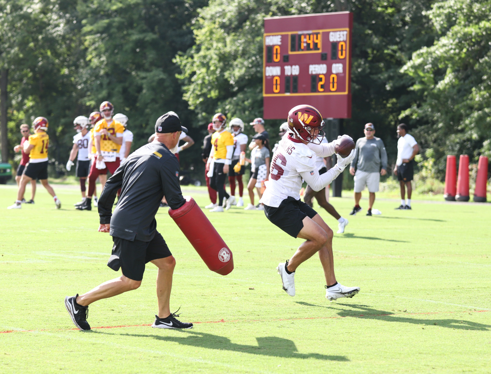 WR Alex Erickson (86) follows through with the catch at the Com