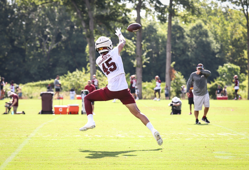 TE Curtis Hodges (45) leaps to make the catch the catch at the C