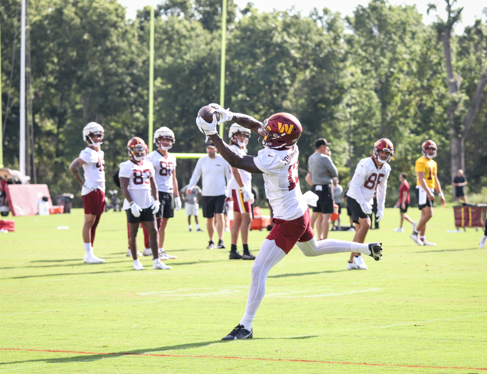 WR Kelvin Harmon (13) makes a catch at the Commanders training c
