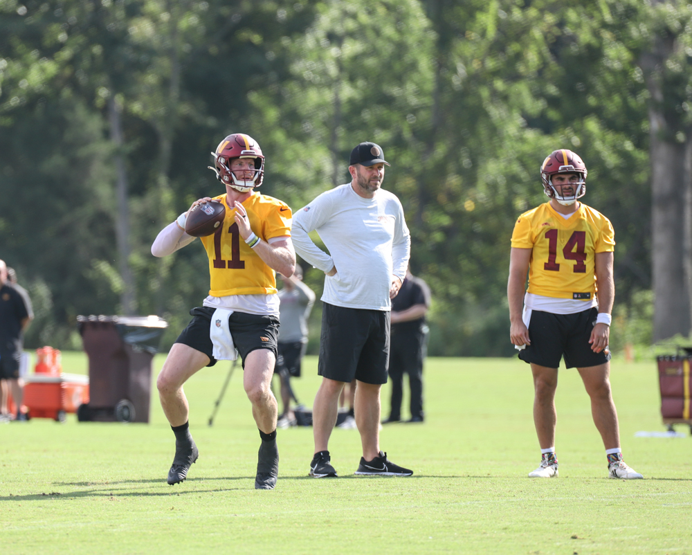 Quarterback Carson Wentz (11) makes a throw at the Commanders tr