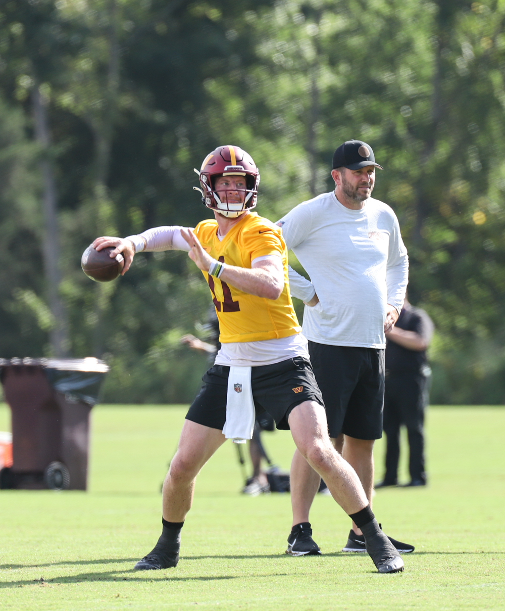 Quarterback Carson Wentz (11) makes a throw at the Commanders tr