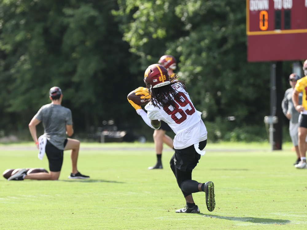 WR Cam Sims (89) makes the catch at the Commanders training cam