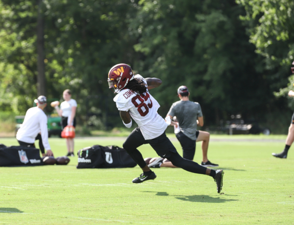 WR Cam Sims (89) makes the running play at the Commanders traini