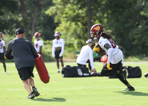 WR Cam Sims (89) makes the running play at the Commanders traini