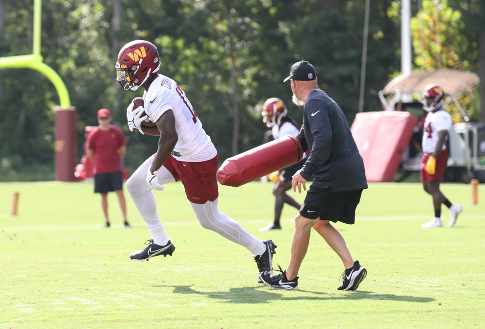 WR Terry McLaurin (17) runs past the coach at the Commanders tra