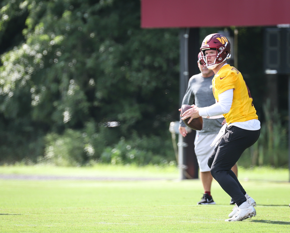 Quarterback Taylor Heinicke (4) prepares to make a throw at the