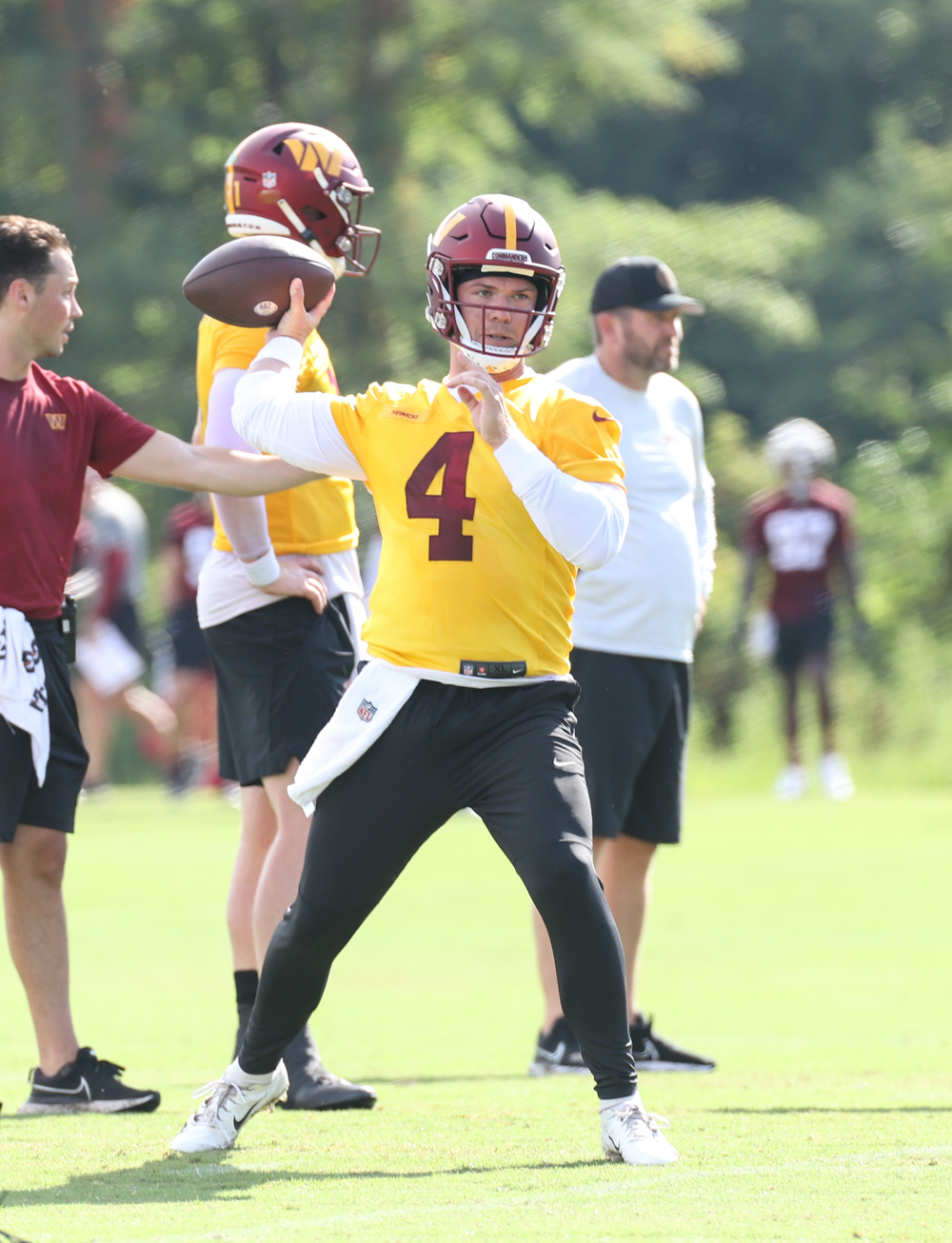 Quarterback Taylor Henicke (4) and Carson Wentz (11) about to ma