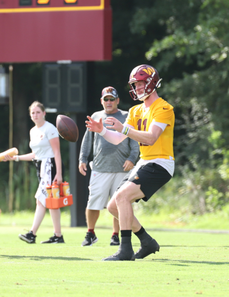 Quarterback Carson Wentz (11) about to make a catch before makin