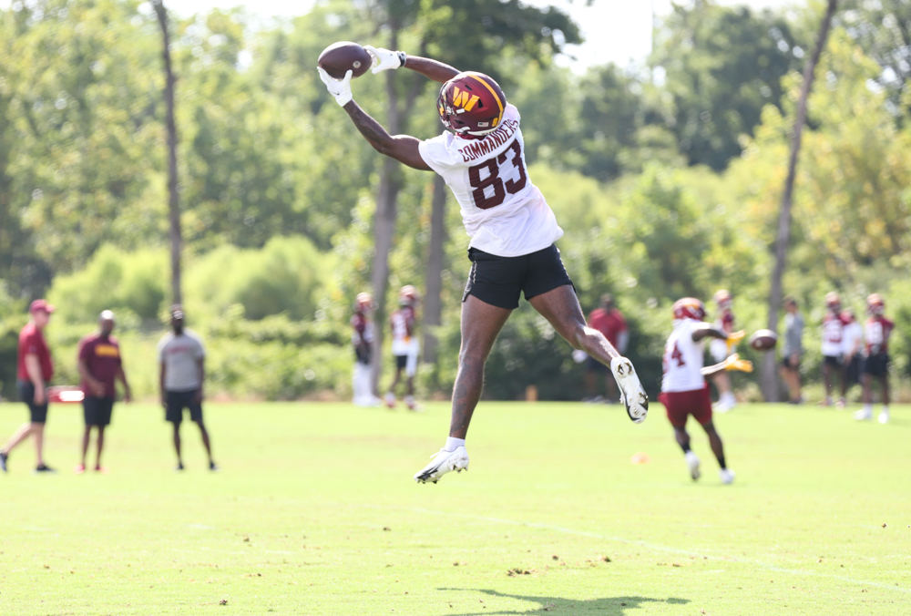 WR Kyric McGowan (83) leaps to make a catch the pass at the Comm