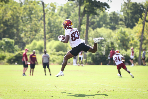 WR Kyric McGowan (83) leaps to make a catch the pass at the Comm