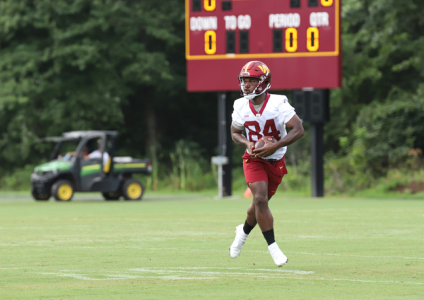 WR Jequez Ezzard (84) completing a catch during the Commanders