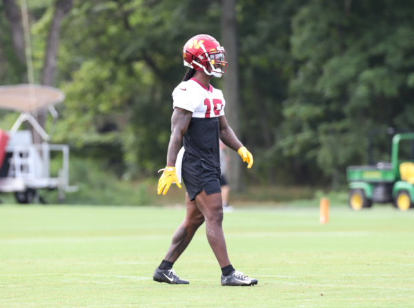 WR Marken Michel (19) walks the field during the Commanders tra