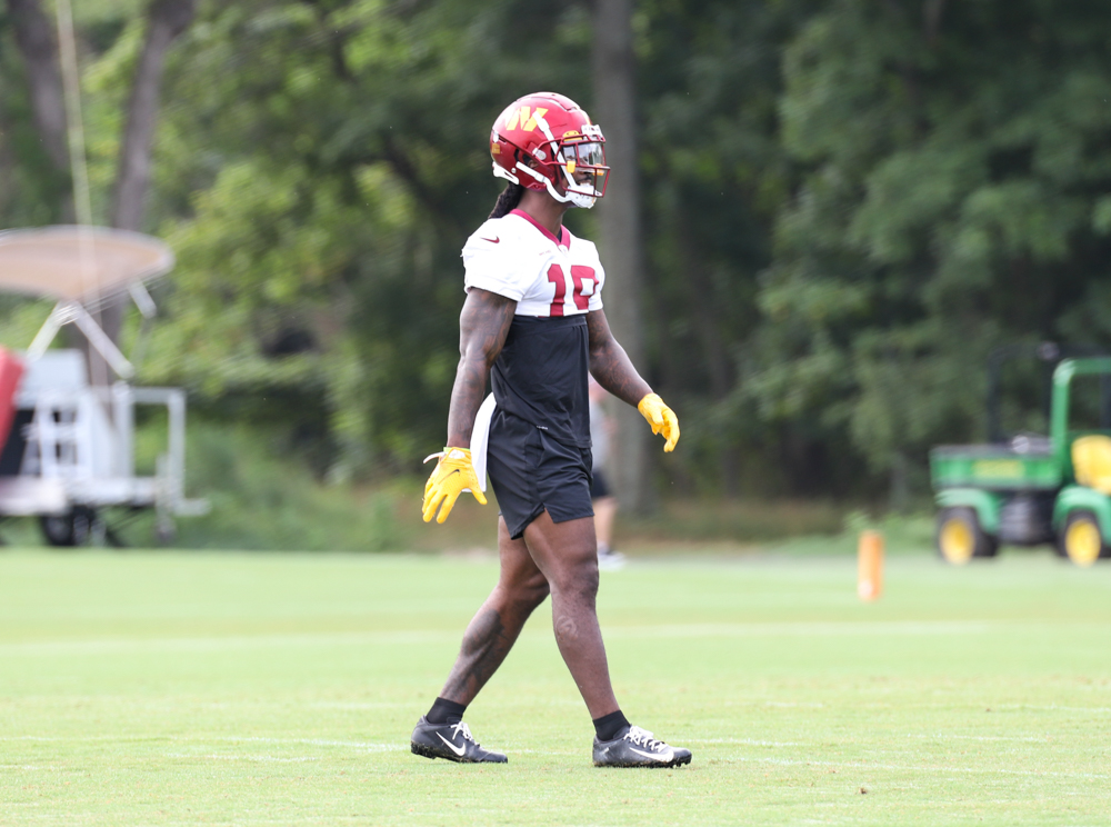 WR Marken Michel (19) walks the field during the Commanders tra