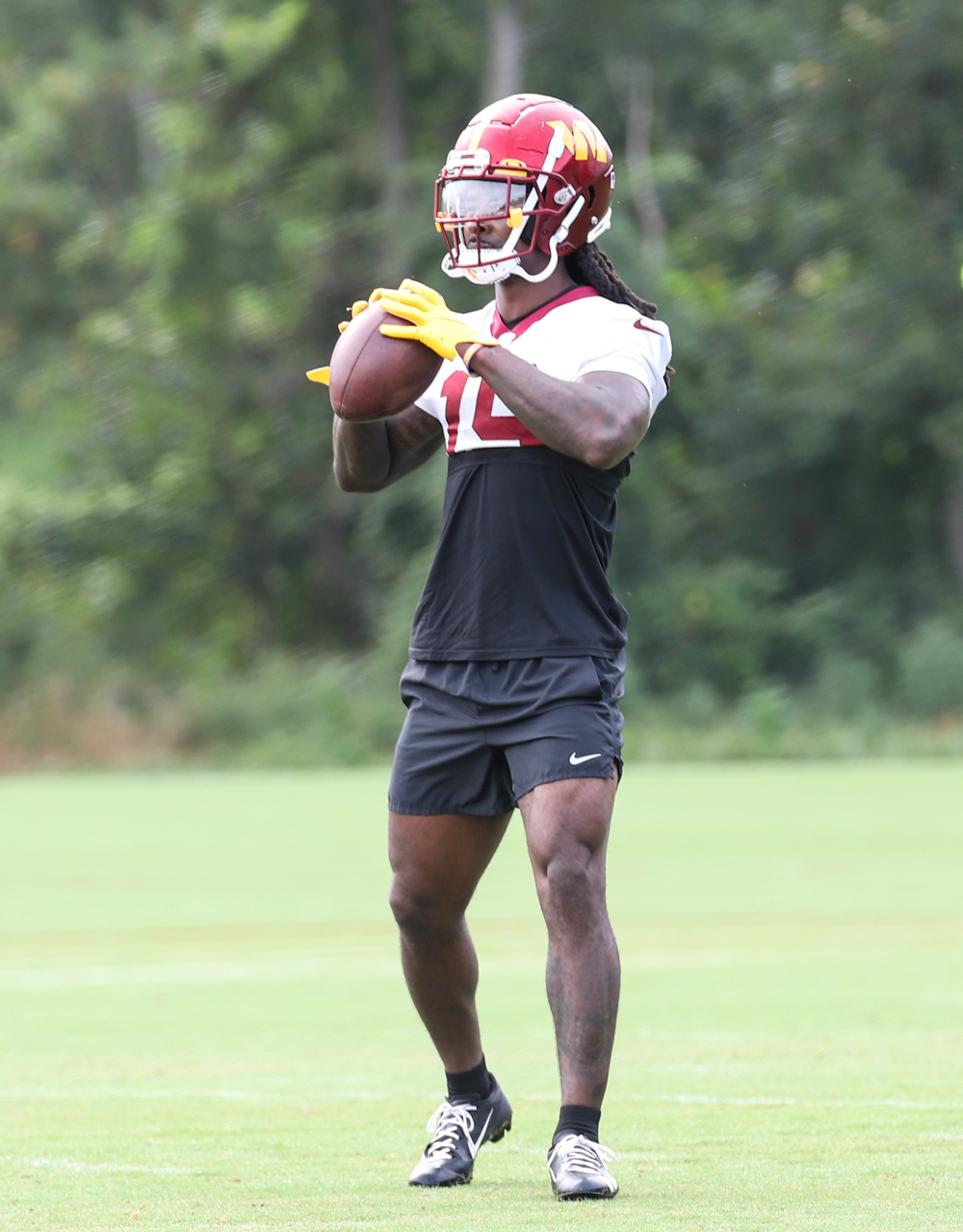 WR Marken Michel (19) about to throw the ball back to the coach