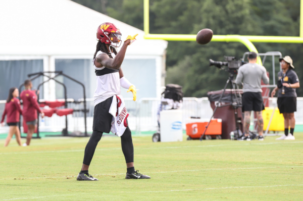 WR Cam Sims (89) tosses the ball back to the coach during the