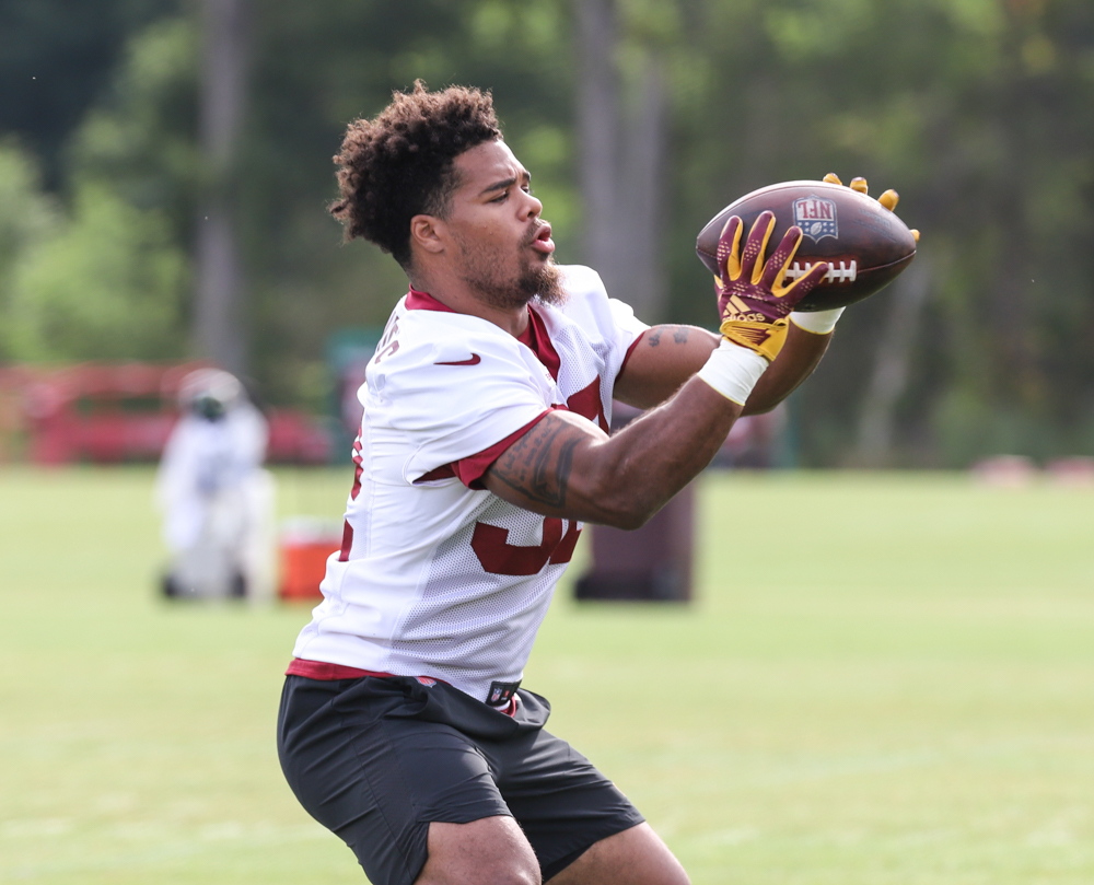 RB Jaret Patterson (32) makes a catch while warming up before pr