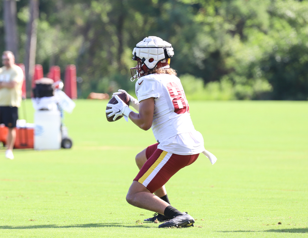 Washington Commanders Tight End Cole Turner (85) makes a catch a
