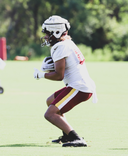 Washington Commanders Tight End Cole Turner (85) makes a catch a