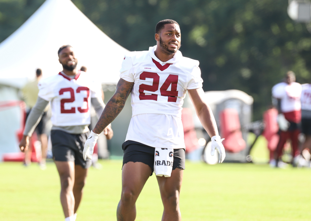 Washington Commanders Running Back Antonio Gibson (24) stretchin