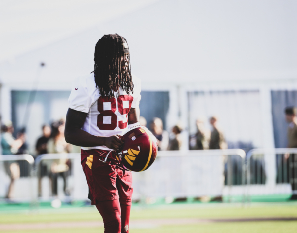 Washington Commanders Wide Receiver, Cam Sims (89) taking the fi