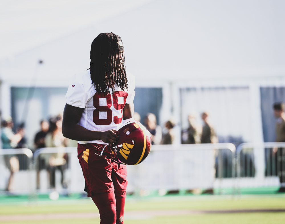 Washington Commanders Wide Receiver, Cam Sims (89) taking the fi