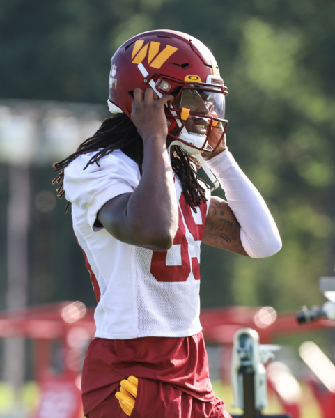 Washington Commanders Wide Receiver, Cam Sims (89) taking the fi