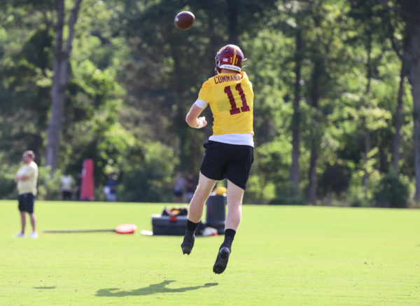 Washington Commanders Quarterback Carson Wentz (11) throwing the