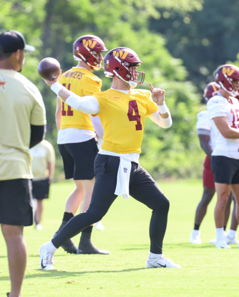 Washington Commanders Quarterback Taylor Heinicke (4) throwing t